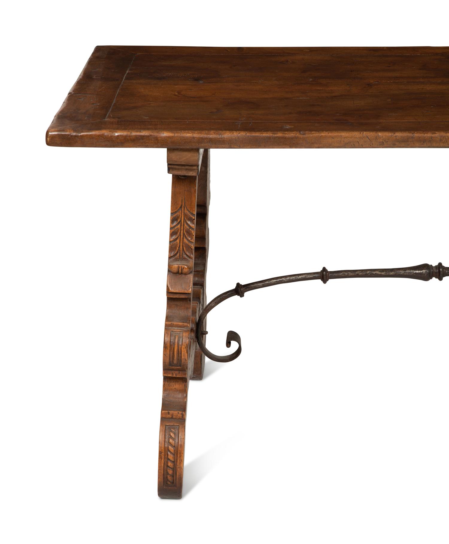 A Spanish Walnut and Wrought Iron Trestle Table