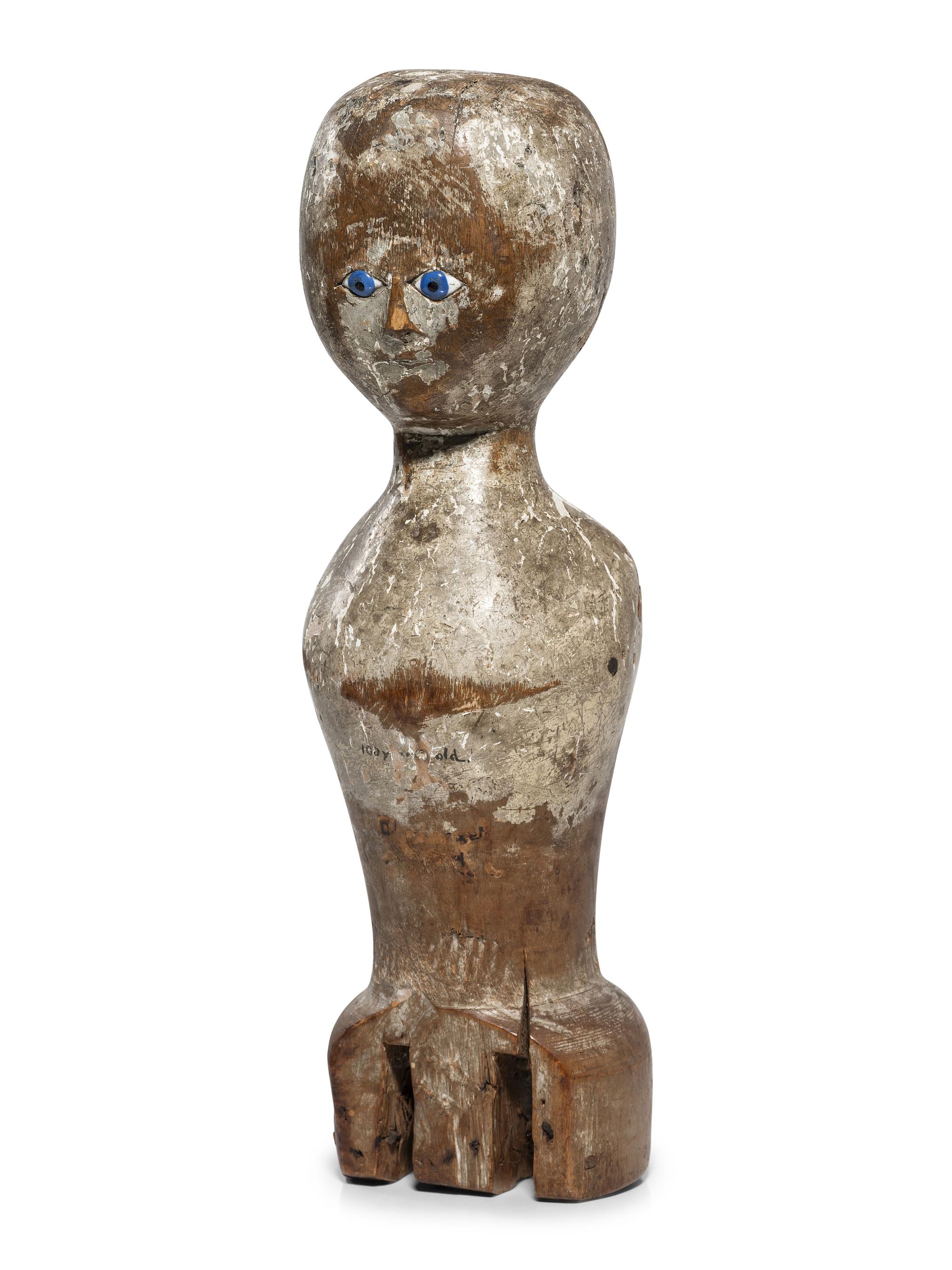 A Folk Art Carved, Painted and Glass Inset Wood Doll "Bed Post" Figure