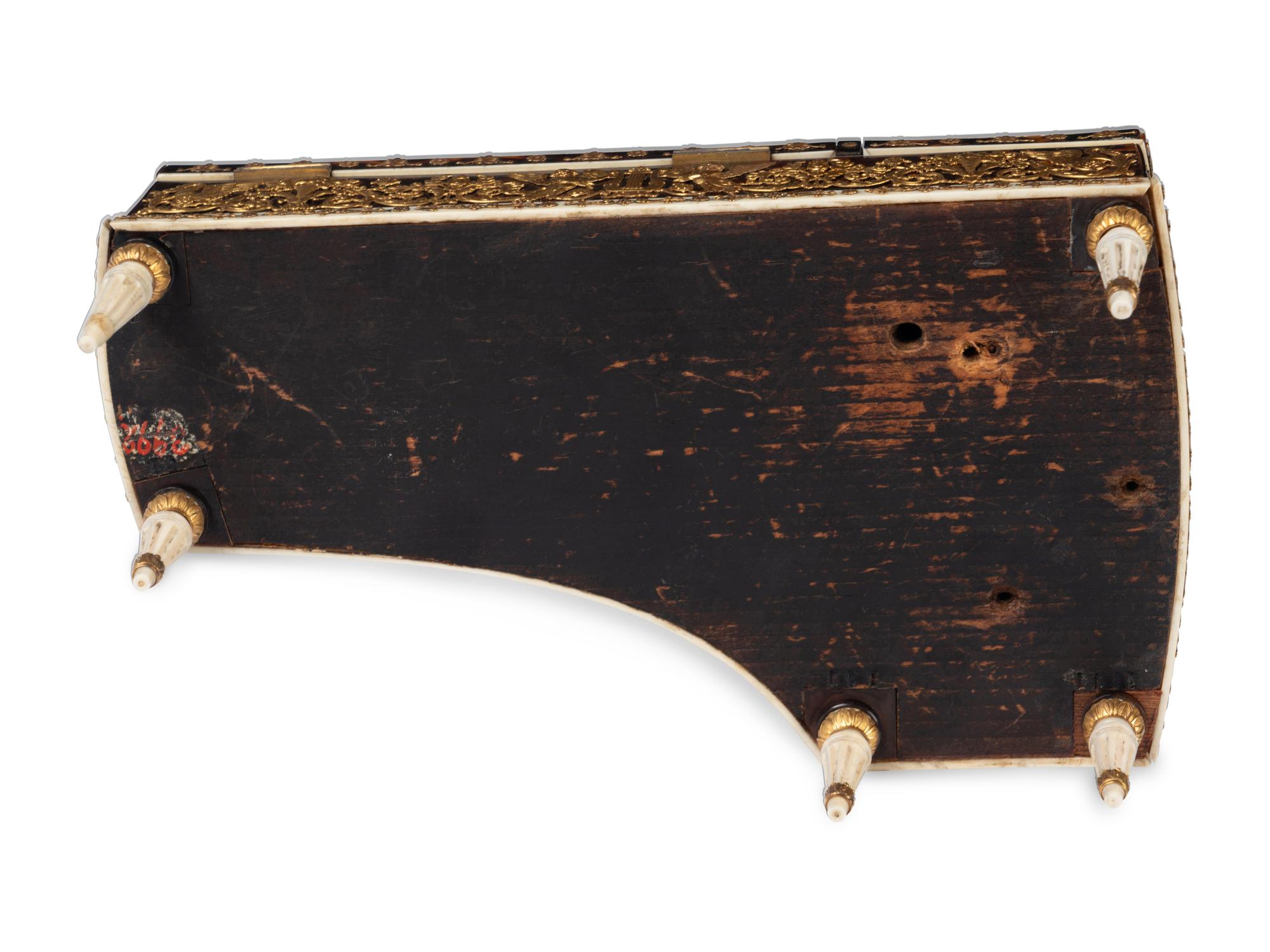 A Palais Royal Gilt Metal Mounted Tortoise Shell Piano Form Nécessaire Case