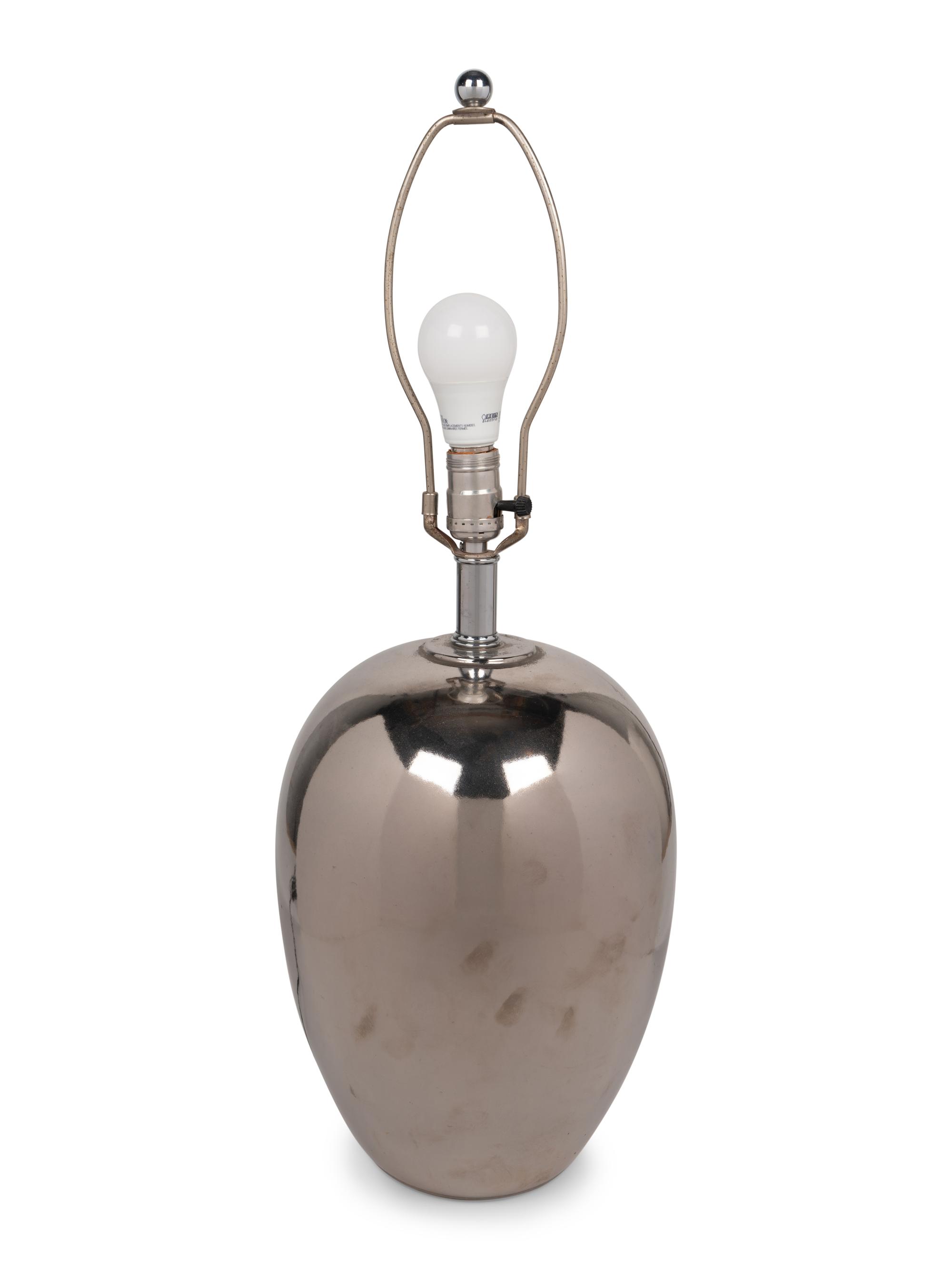 A Silvered Table Lamp with a Quail Feather Shade