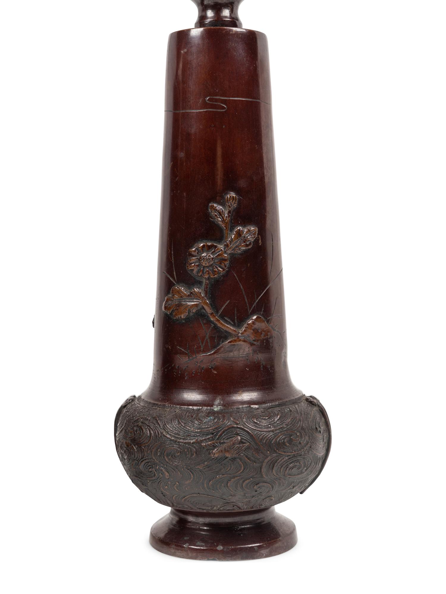 A Pair of Japanese Bronze Candlesticks
