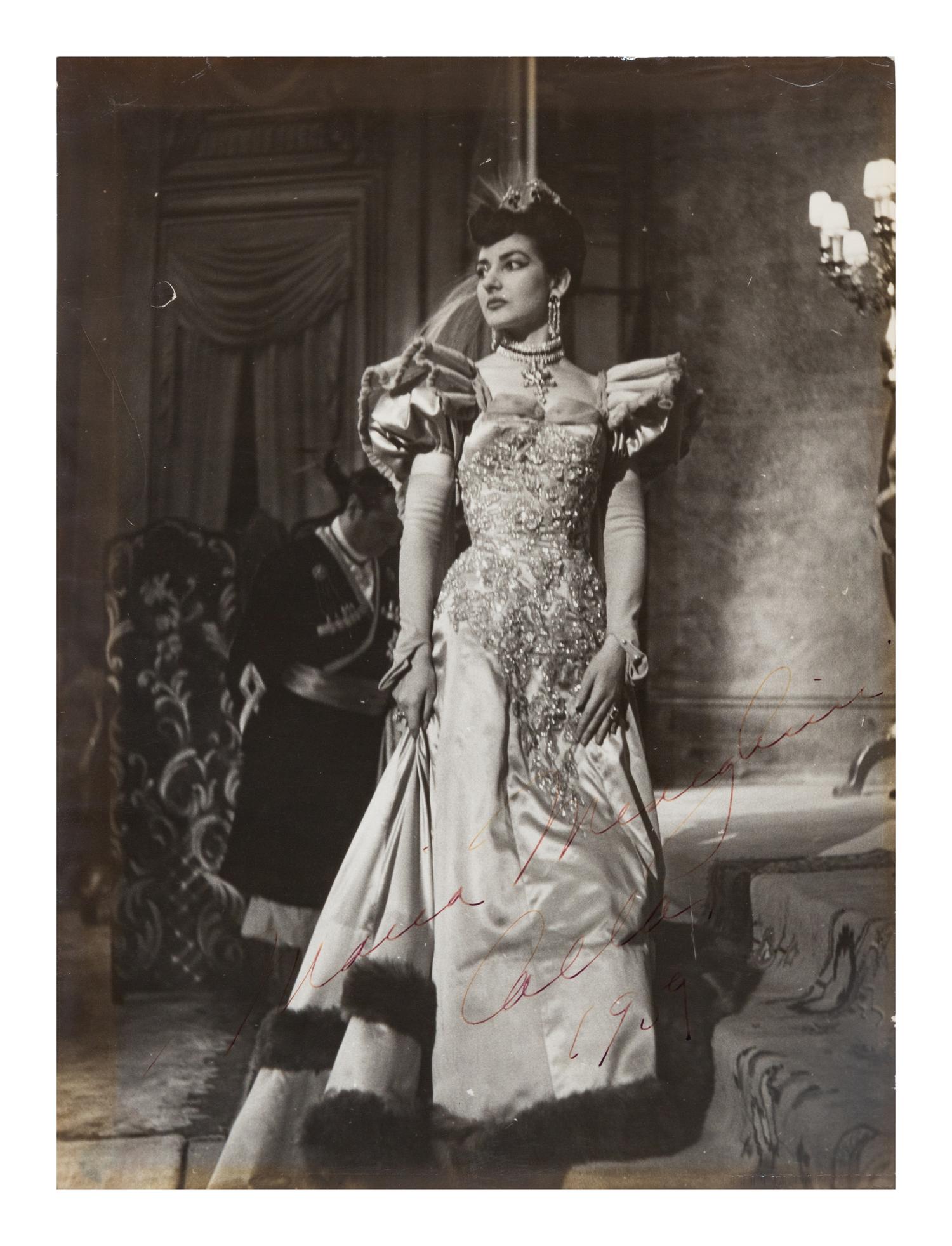 CALLAS, Maria (1923-1977). Black and white photographic portrait, signed (“Maria Menghini Callas 1959”), by Erio Piccagliani.