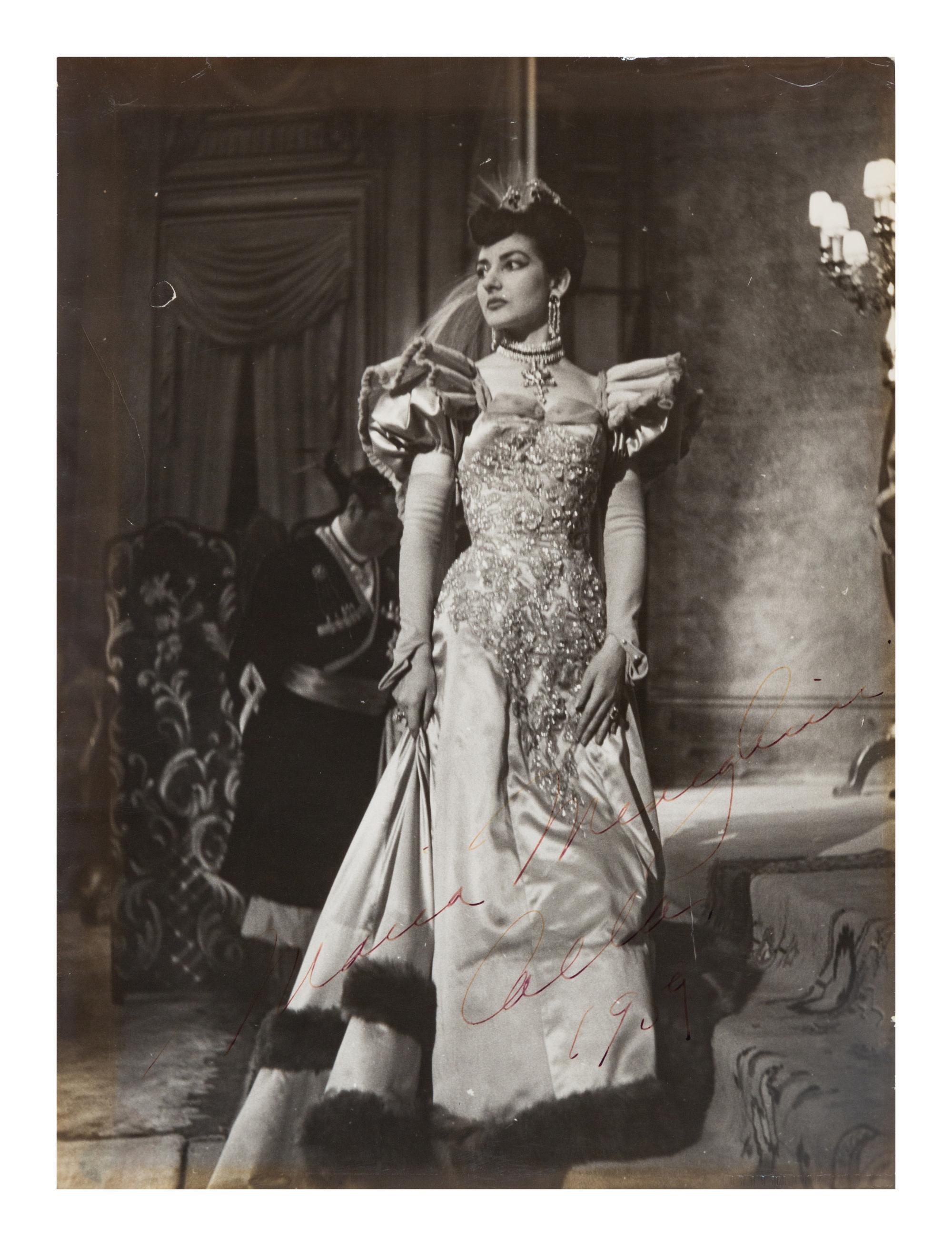 CALLAS, Maria (1923-1977). Black and white photographic portrait, signed (“Maria Menghini Callas 1959”), by Erio Piccagliani.