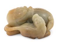 A Chinese Celadon and Russet Jade Carving of Two Mythical Beasts