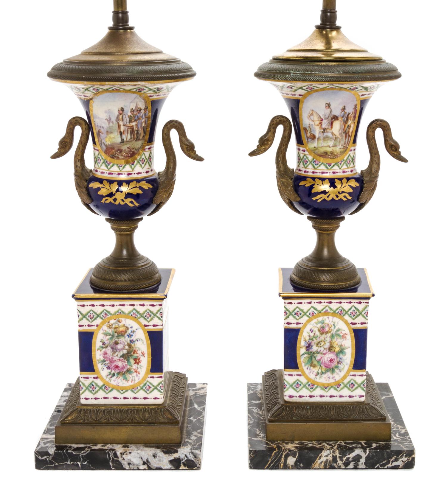 A Pair of Sevres Style Gilt Metal Mounted Porcelain Urns, Height overall 25 3/8 inches.