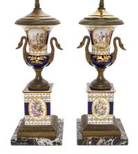 A Pair of Sevres Style Gilt Metal Mounted Porcelain Urns, Height overall 25 3/8 inches.