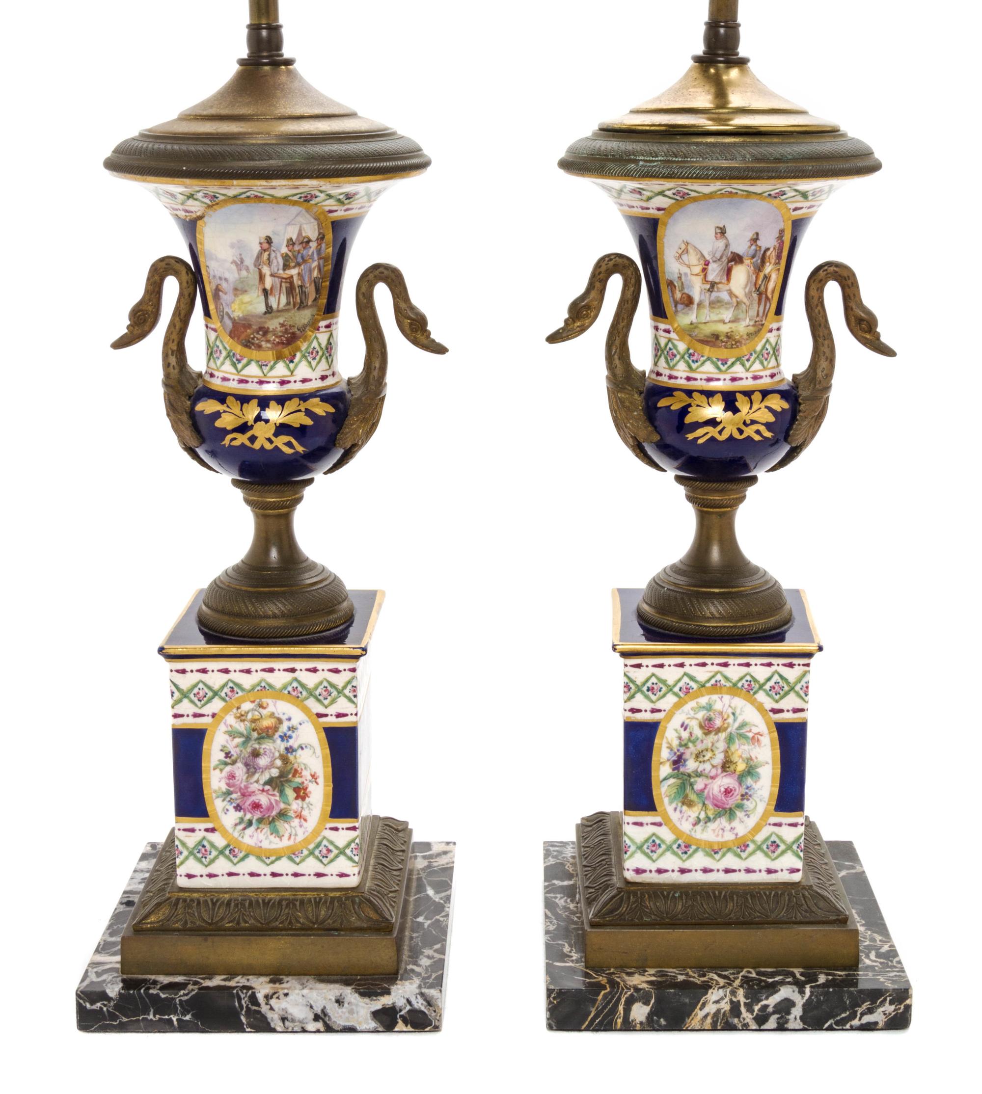 A Pair of Sevres Style Gilt Metal Mounted Porcelain Urns, Height overall 25 3/8 inches.