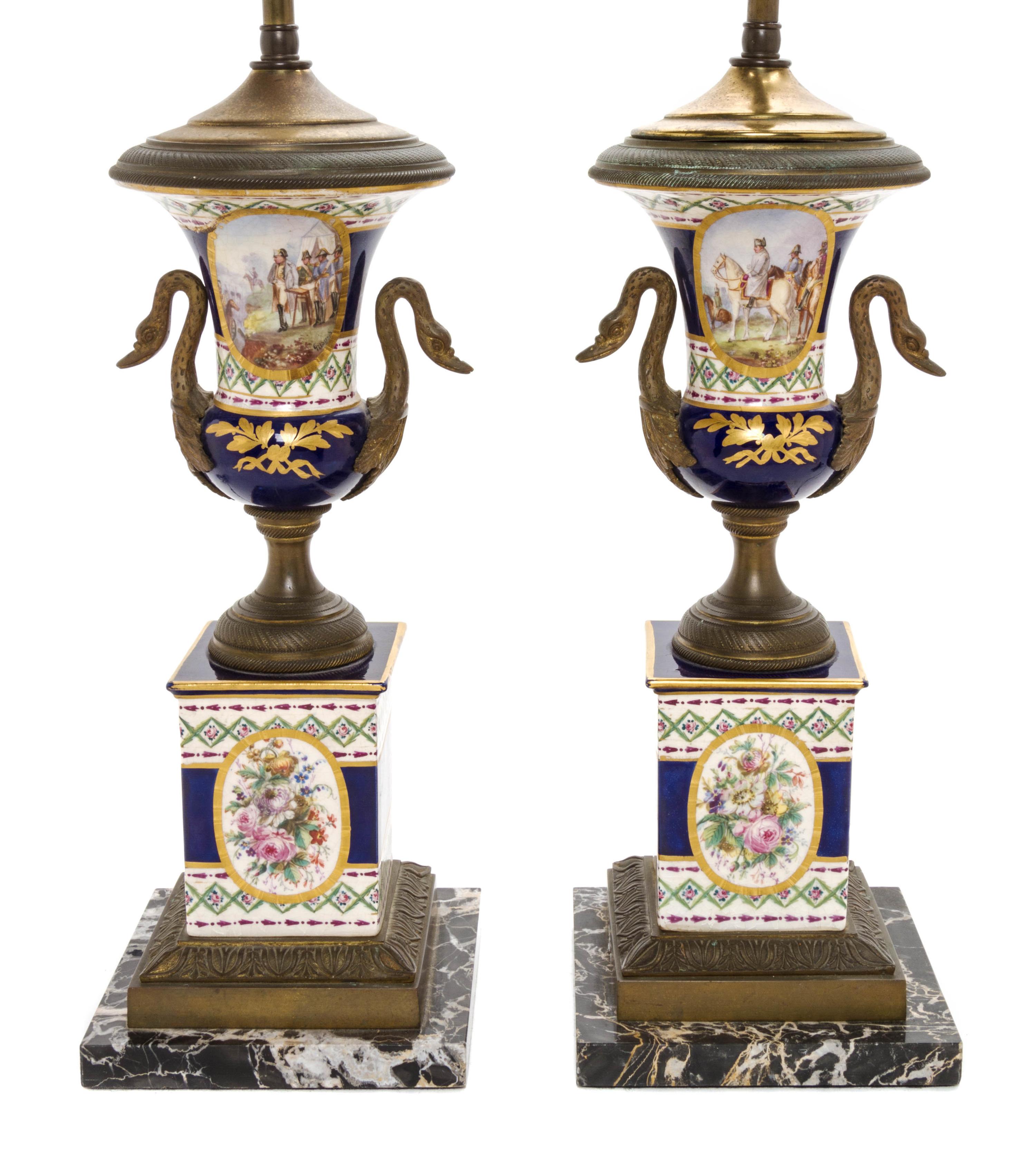 A Pair of Sevres Style Gilt Metal Mounted Porcelain Urns, Height overall 25 3/8 inches.