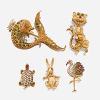 A collection of five gold and gem-set brooches