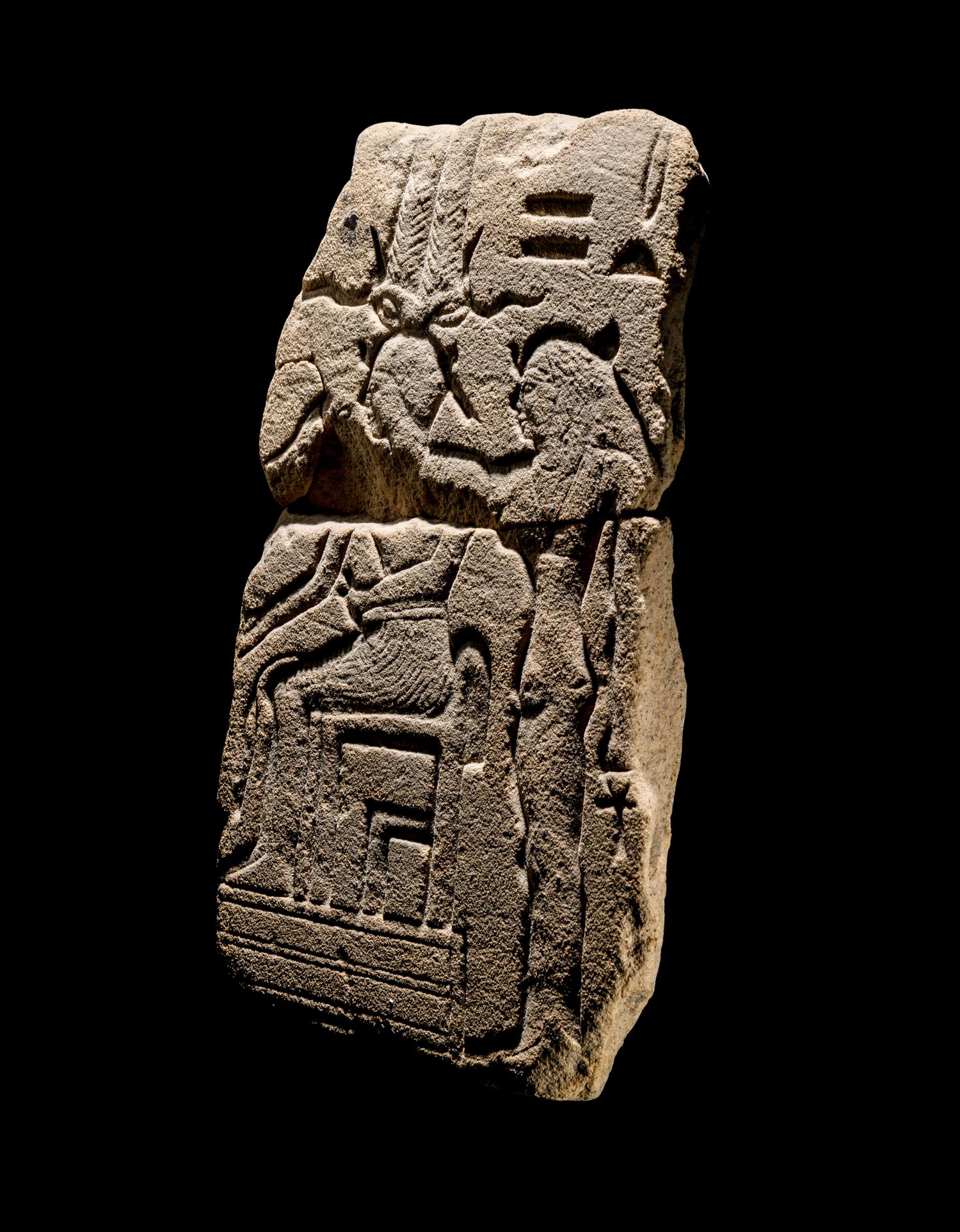 An Egyptian Sandstone Fragment with Osiris and Isis