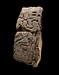 An Egyptian Sandstone Fragment with Osiris and Isis