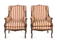A Pair of Louis XV Style Carved Wingback Armchairs
