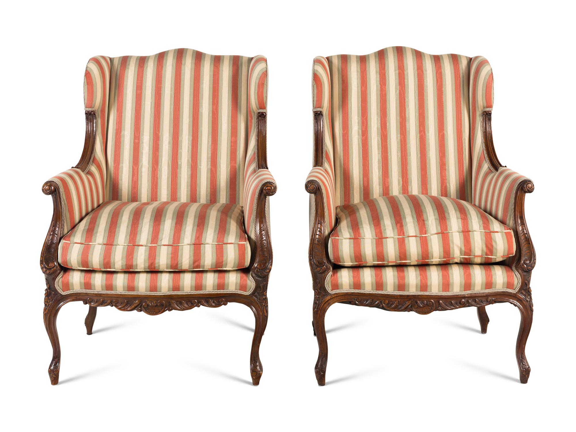 A Pair of Louis XV Style Carved Wingback Armchairs