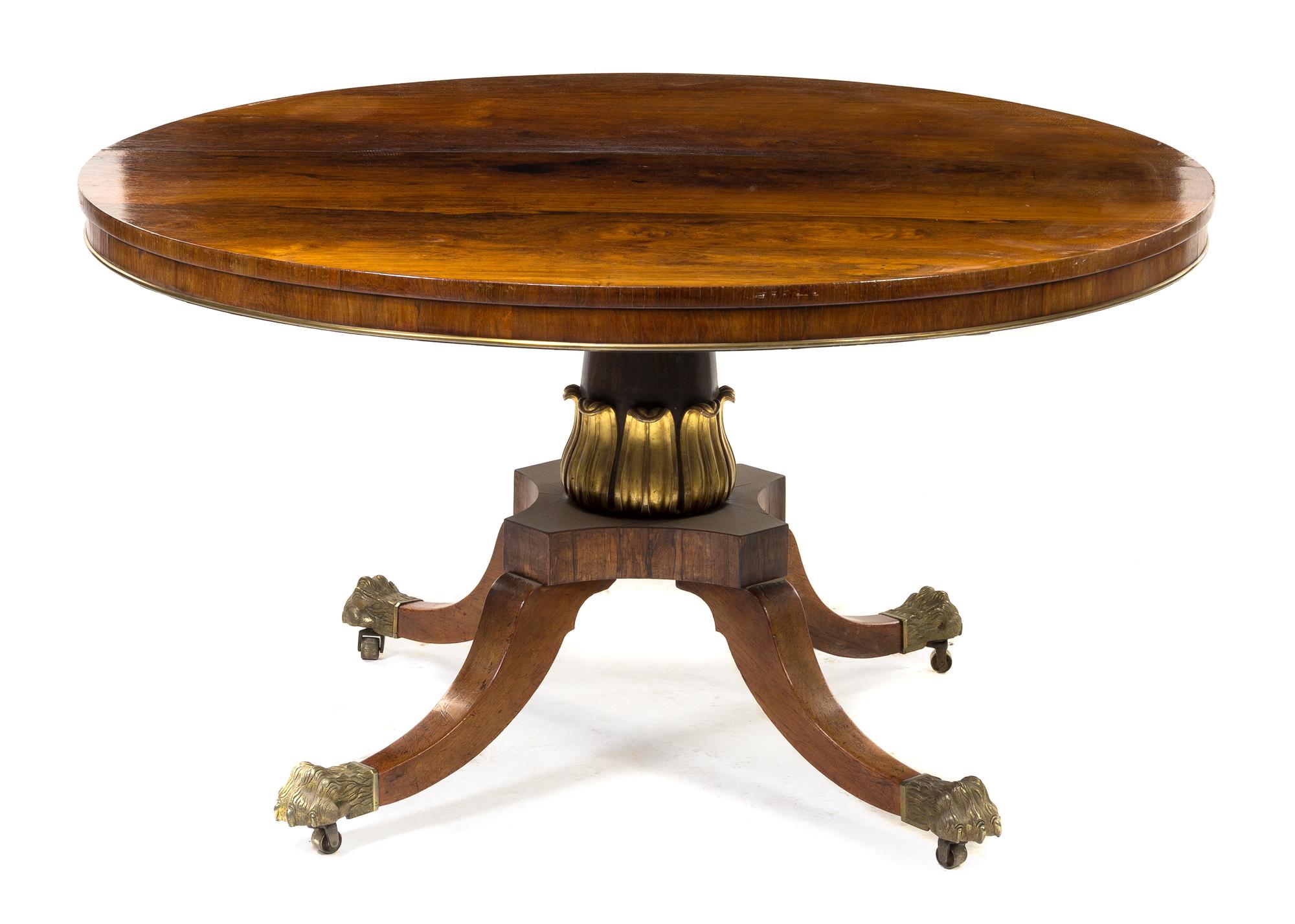 A Regency Brass Banded Rosewood Center Table Height 28 x depth 51 1/2 inches. — FIRST QUARTER 19TH CENTURY
