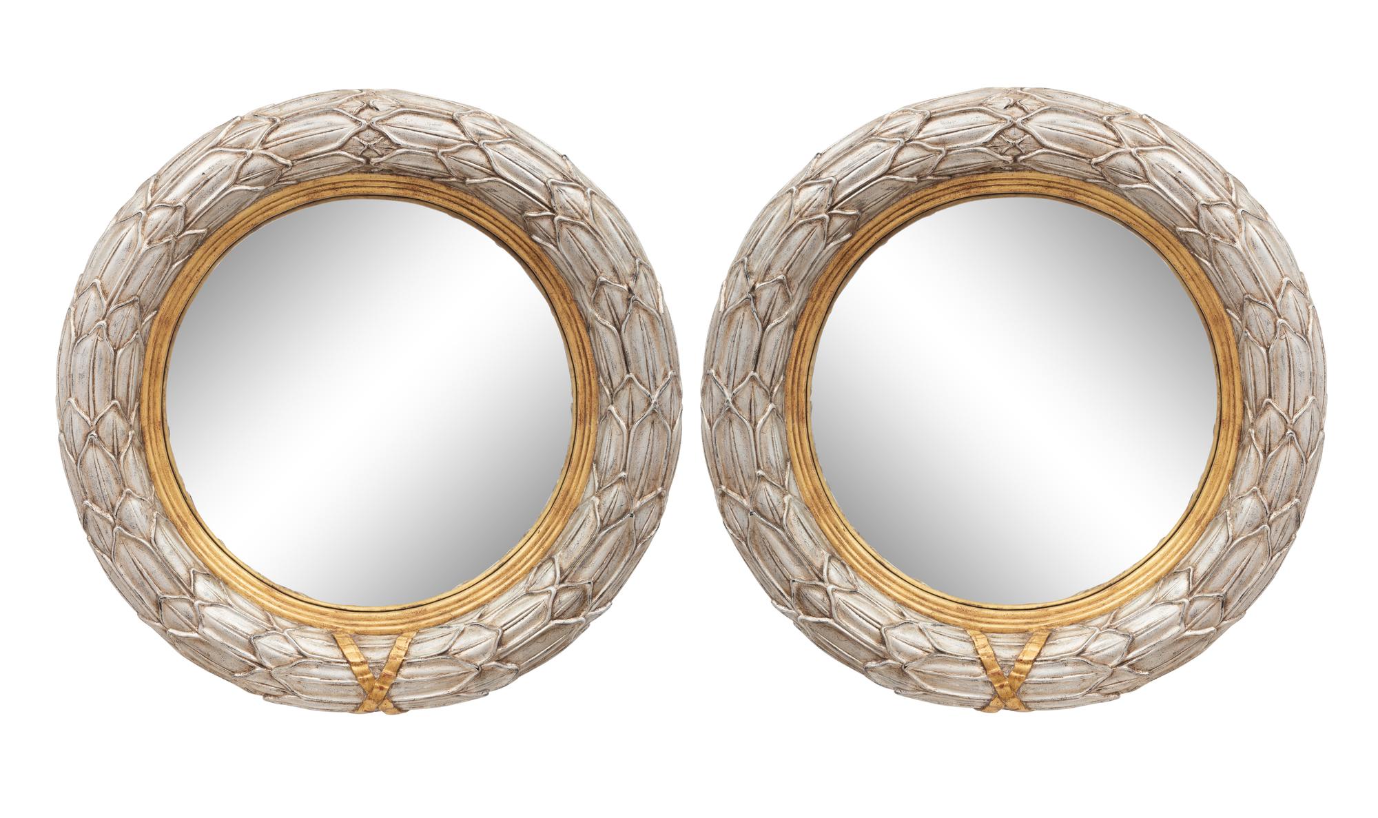 A Pair of Silvered and Parcel Gilt Convex Mirrors