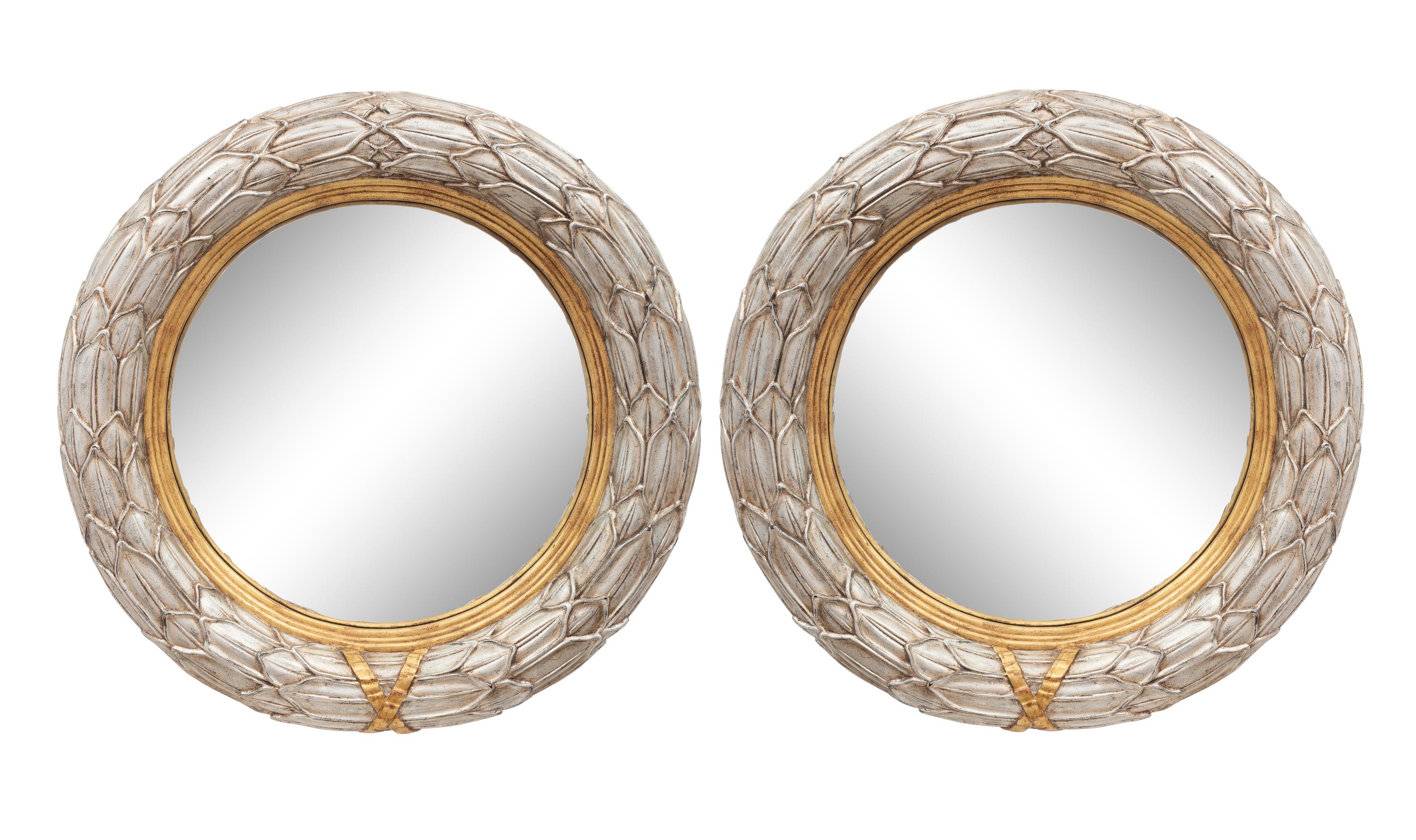 A Pair of Silvered and Parcel Gilt Convex Mirrors