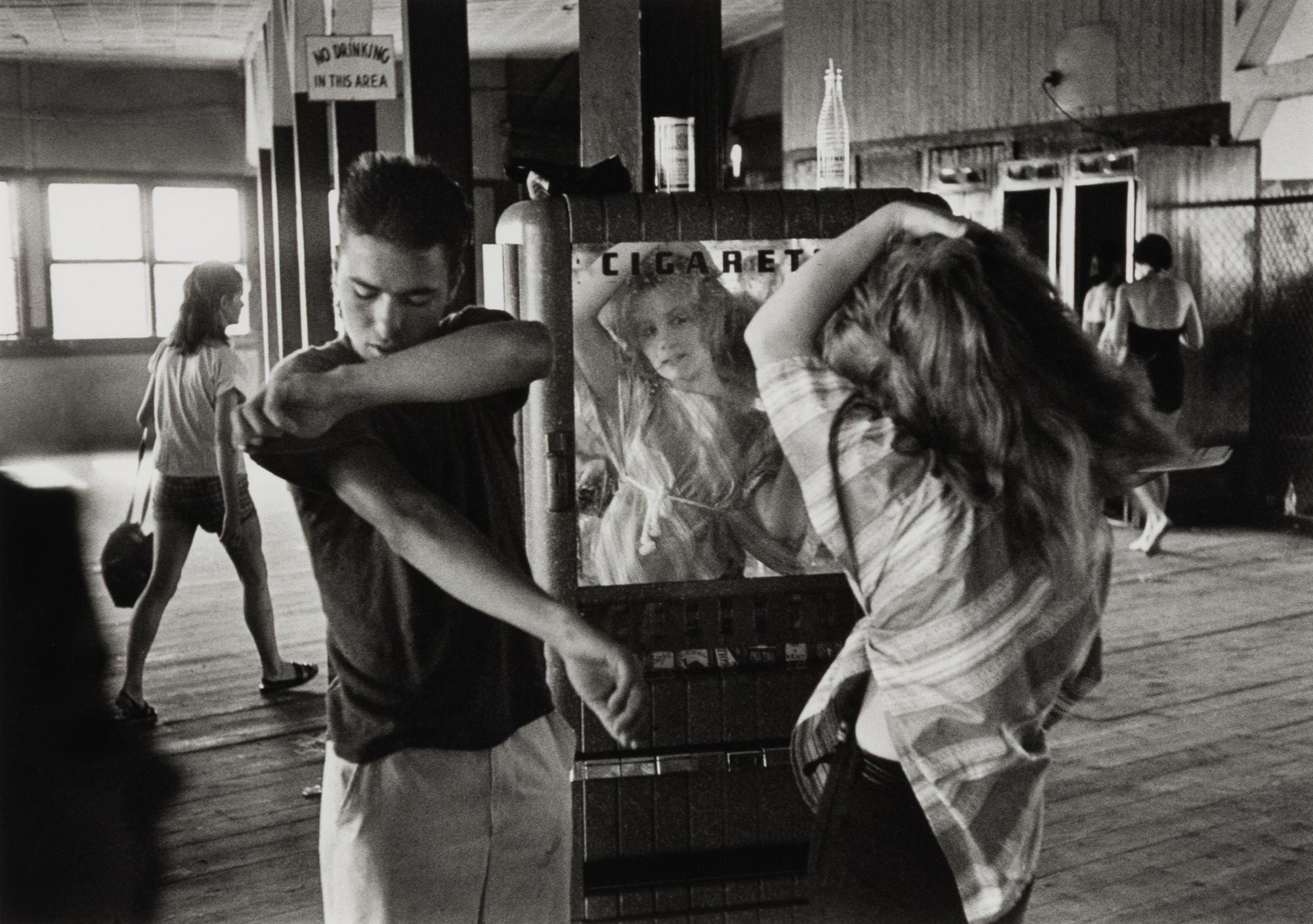 Cathy Fixing her Hair in Cigarette Machine Mirror (from Brooklyn Gang ) , 1959