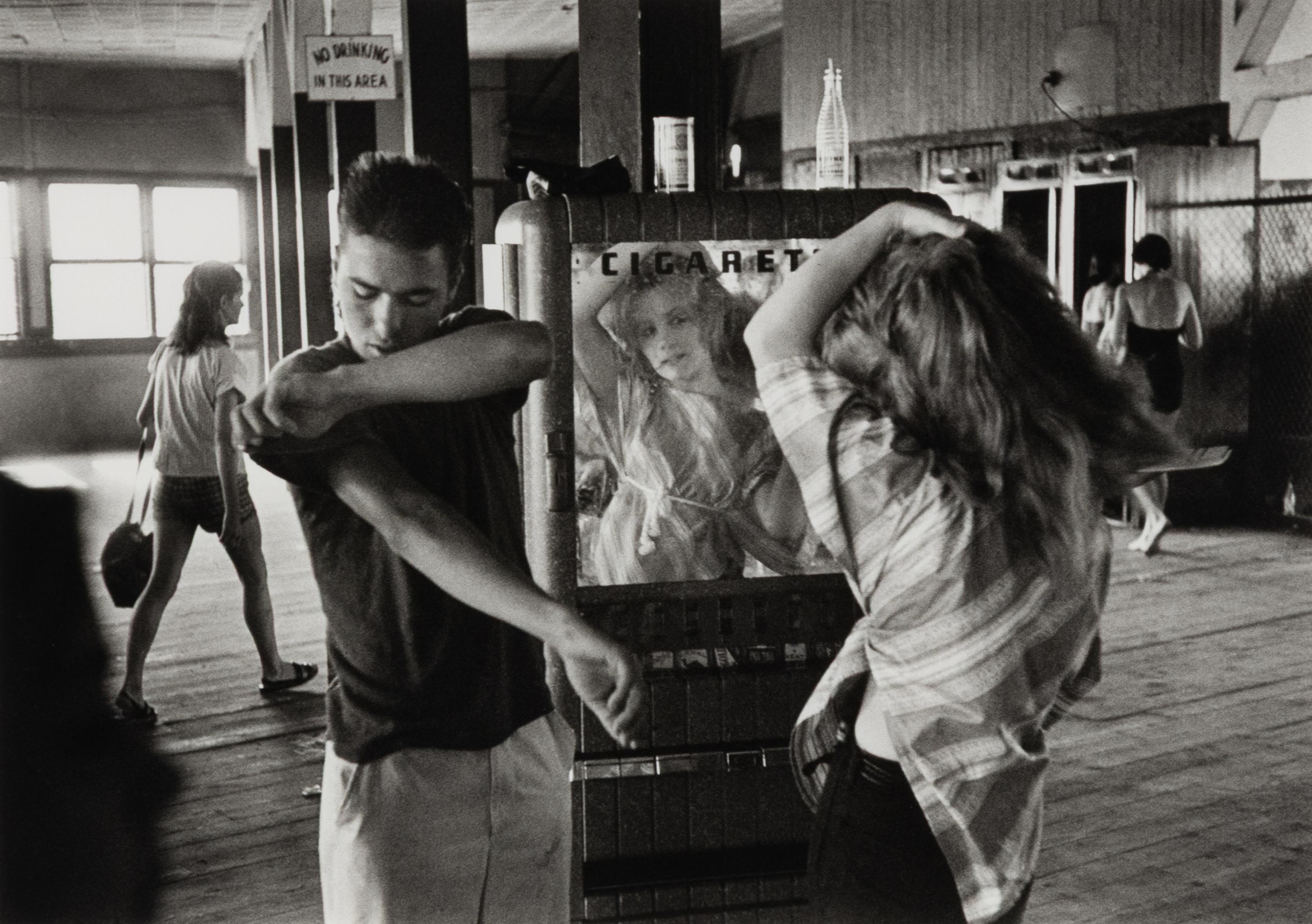 Cathy Fixing her Hair in Cigarette Machine Mirror (from Brooklyn Gang ) , 1959