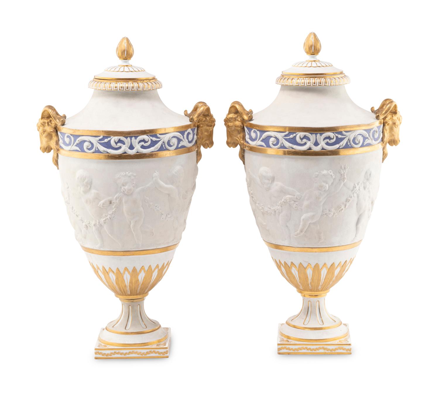A Pair of Sèvres Style Biscuit Porcelain Vases and Covers