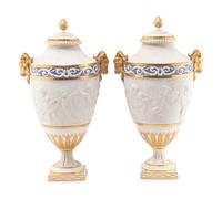 A Pair of Sèvres Style Biscuit Porcelain Vases and Covers