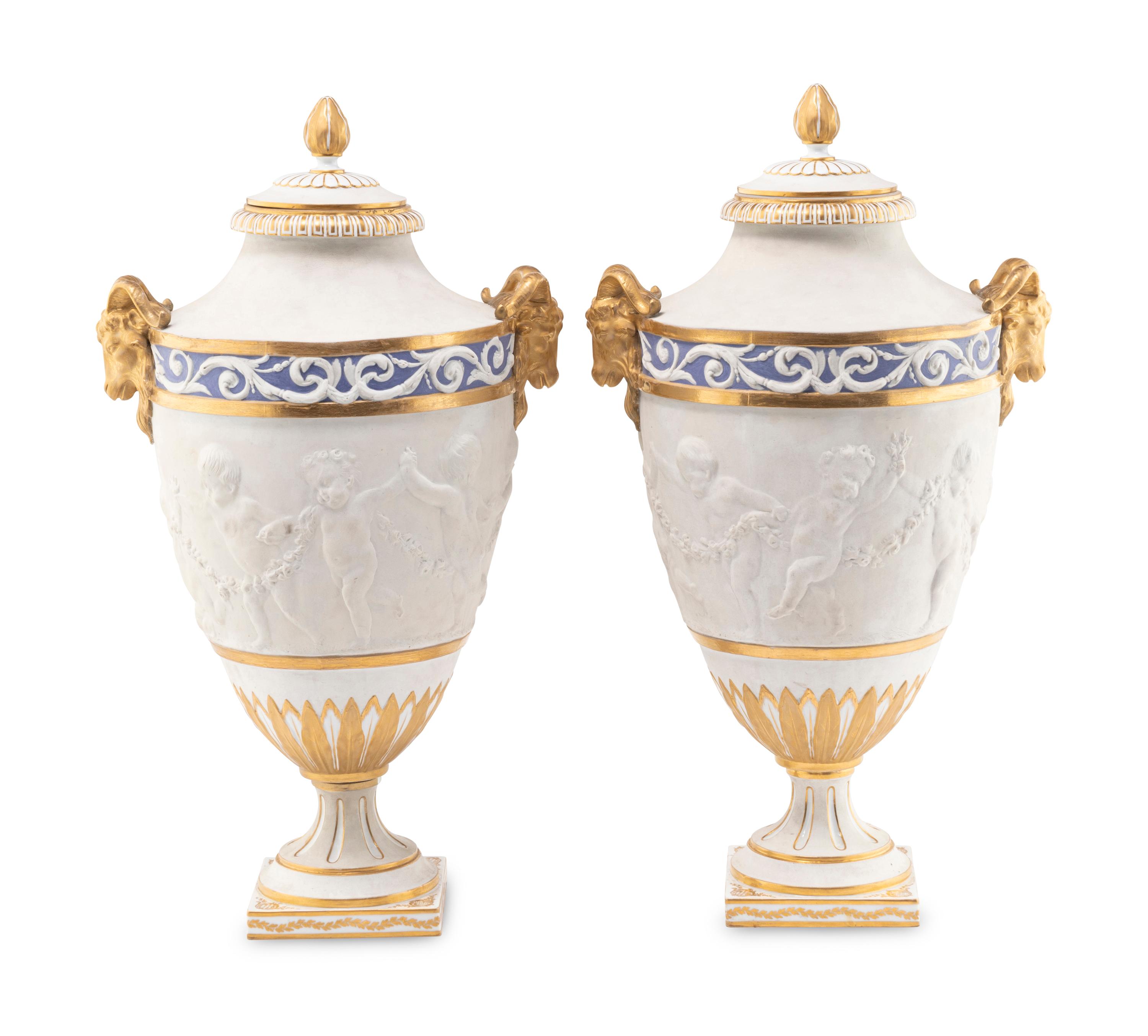 A Pair of Sèvres Style Biscuit Porcelain Vases and Covers