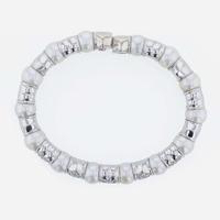 An 18K white gold, cultured pearl, and diamond bangle Italy