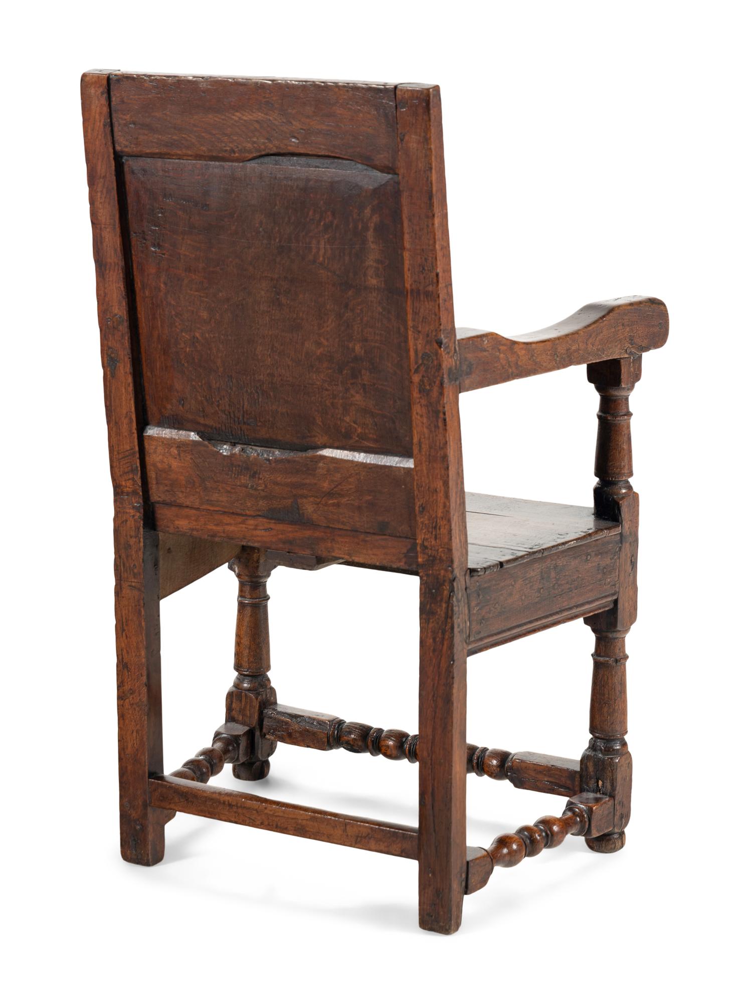 A William and Mary Carved Oak Open Armchair