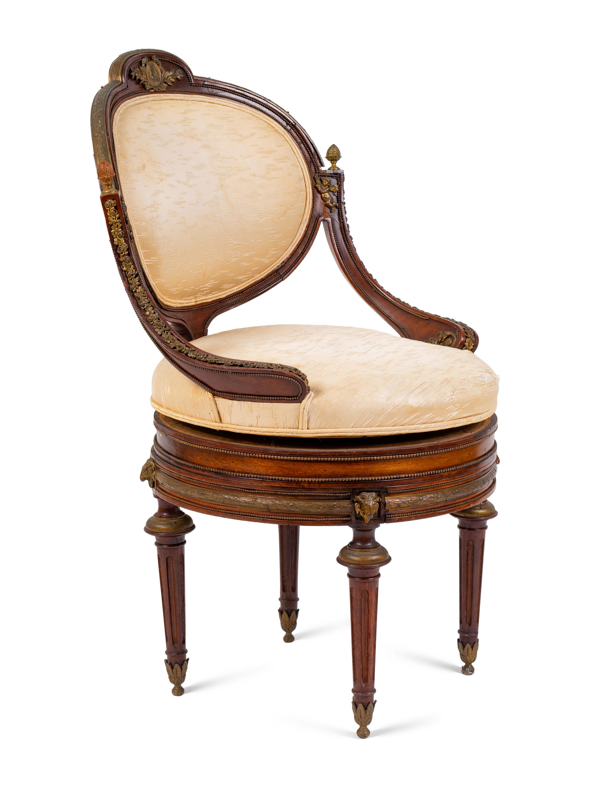 A Regency Style Gilt Metal Mounted Mahogany Swivel Chair — 19TH CENTURY