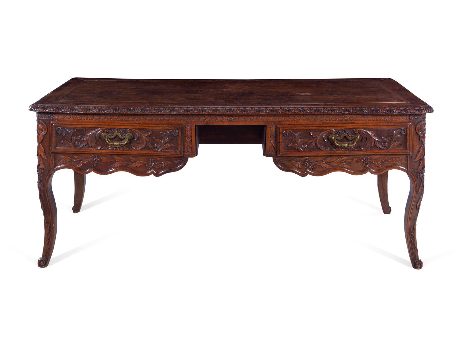 A Louis XV Provincial Style Carved Walnut Desk