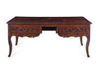A Louis XV Provincial Style Carved Walnut Desk