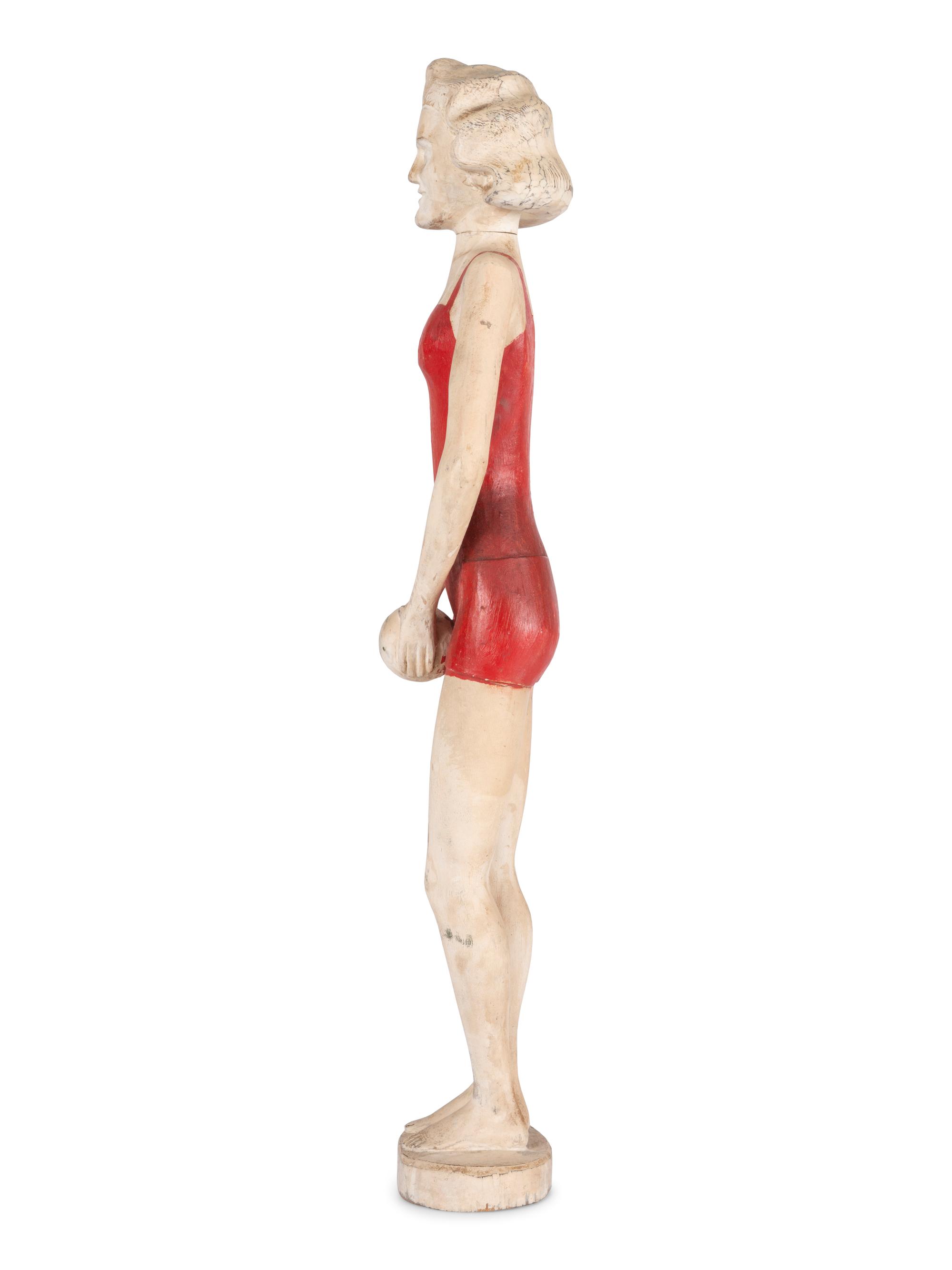 A Carved and Painted Wood Figure of a Bather