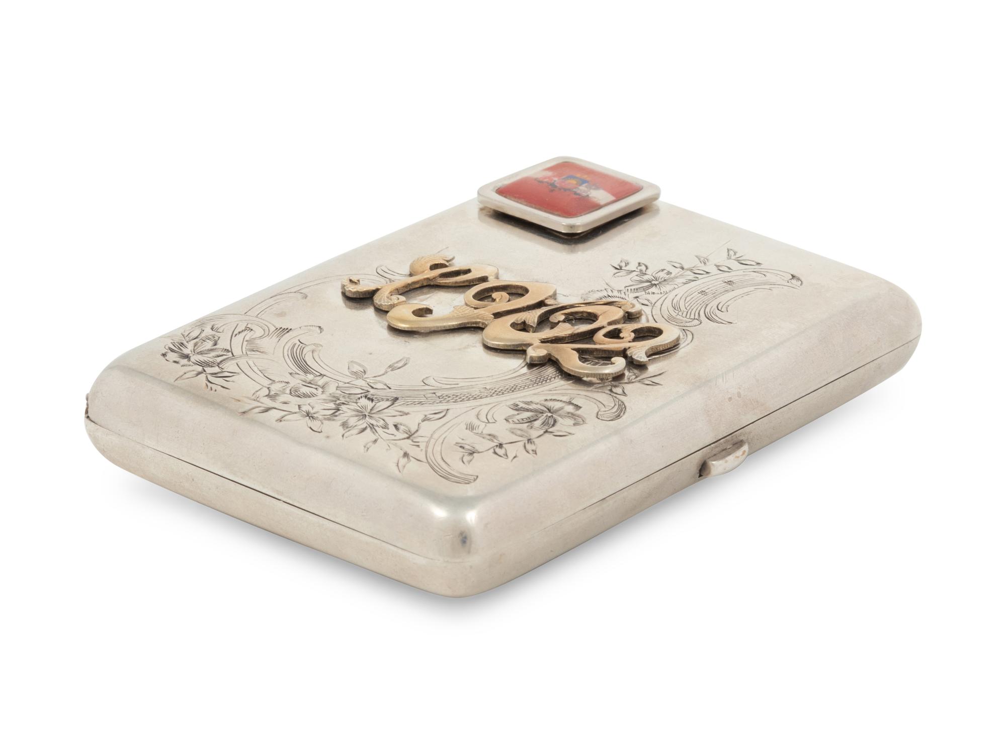 A Russian Gold, Silver and Enamel Charm Mounted Silver Cigarette Case
