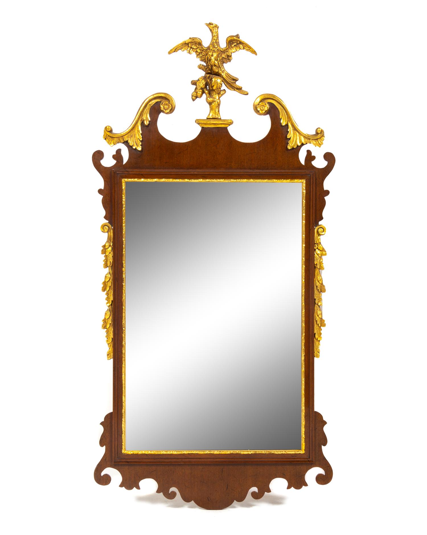 A George III Style Parcel Gilt and Carved Mahogany Mirror