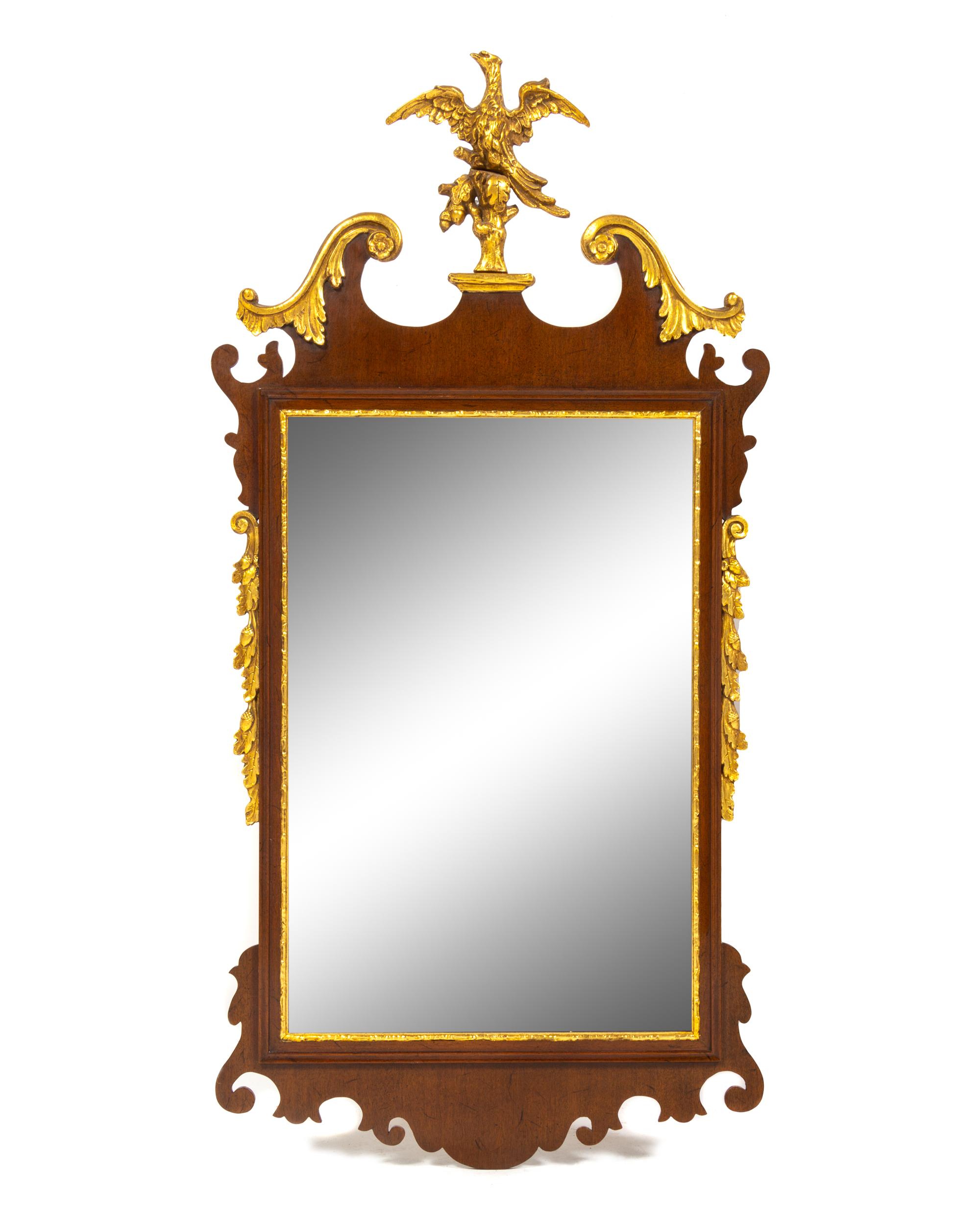 A George III Style Parcel Gilt and Carved Mahogany Mirror