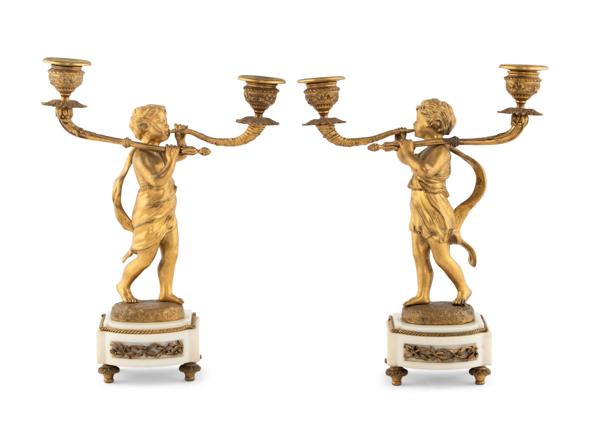A Pair of French Gilt Bronze Figural Two-Light Candelabra