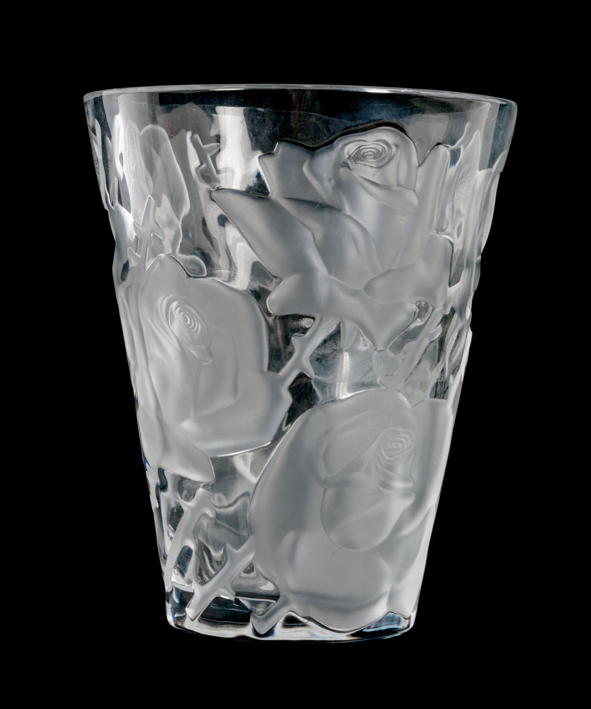 A Lalique Molded and Frosted Glass Vase Height 9 1/2 x diameter 8 inches.