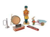 A Group of Children's Musical Instrument Toys and Tin Lithographed Mechanical Objects