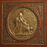 A Louis XVI Style Gilt Bronze Mounted Mahogany Marble-Top Commode à Vantaux, after the Model by Guillaume Benneman