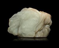 A Chinese Carved Russet and Pale Celadon Jade Boulder