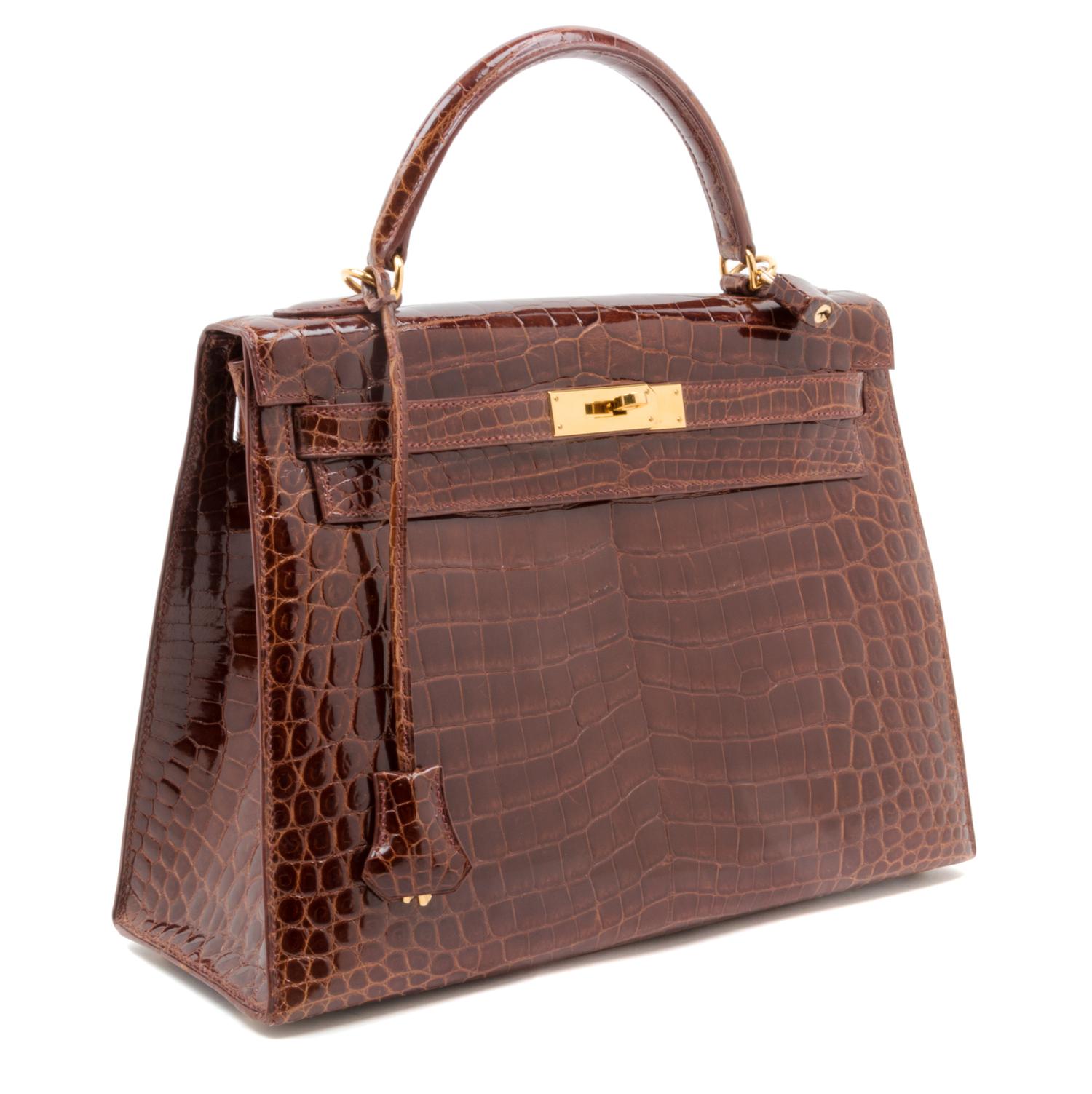 An Hermes Brown Niloticus Crocodile Sellier 32cm Kelly Handbag, 12.5" x 5" x 9.5"; Handle drop: 3.25".