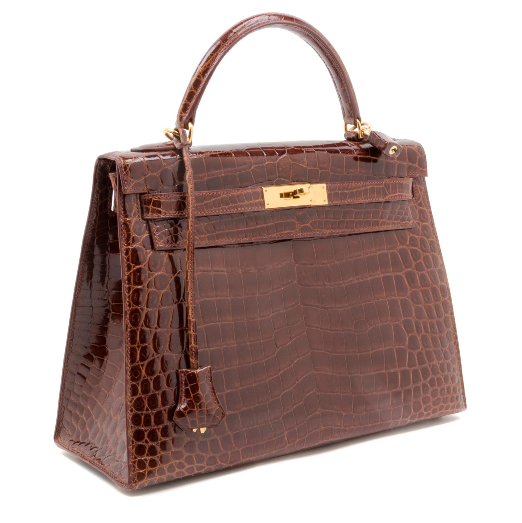 An Hermes Brown Niloticus Crocodile Sellier 32cm Kelly Handbag, 12.5" x 5" x 9.5"; Handle drop: 3.25".