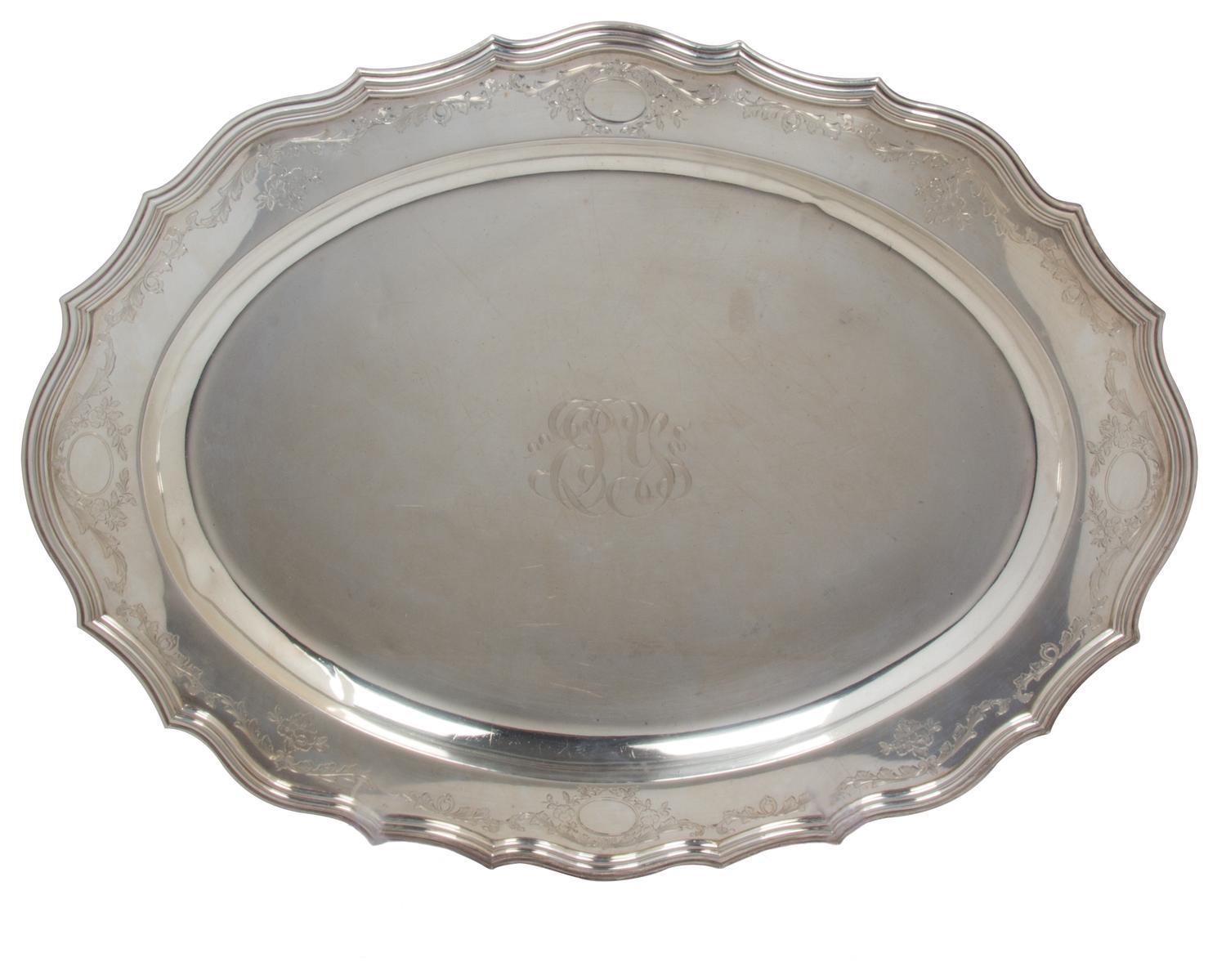 An American Silver Oval Tray, Meriden Brittania, Meriden, CT, having a scalloped border, monogrammed.