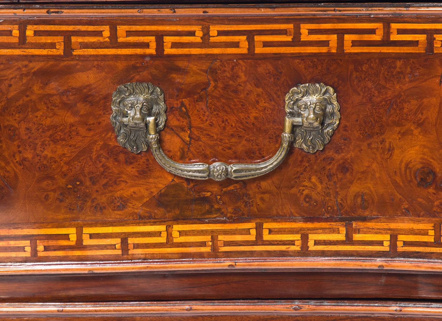 A Rococo Burr Walnut and Fruitwood Commode