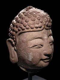 A Pair of Chinese Carved Stone Heads of Buddha