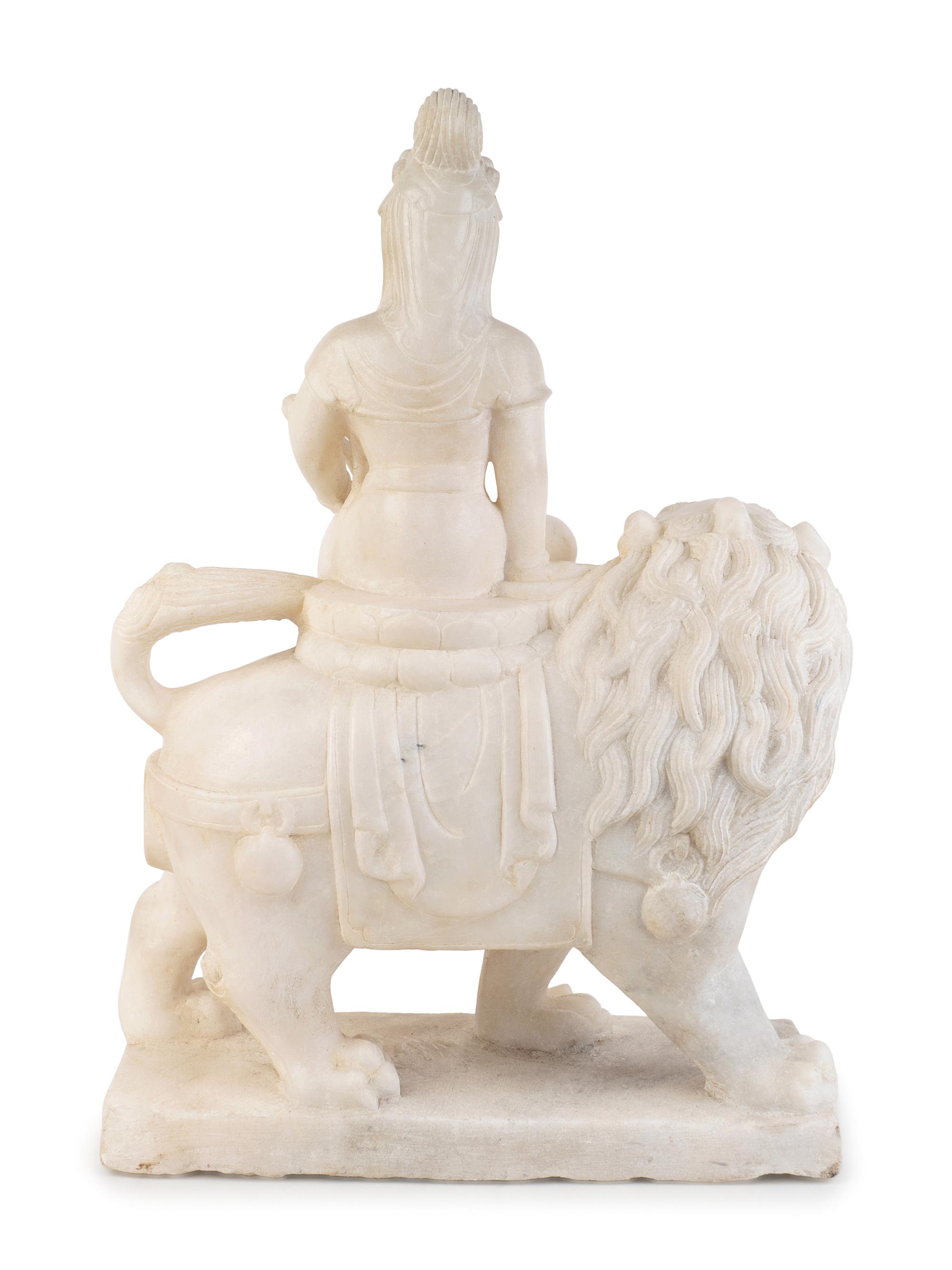 A Chinese Marble Figure of Guanyin Seated on a Fu Lion