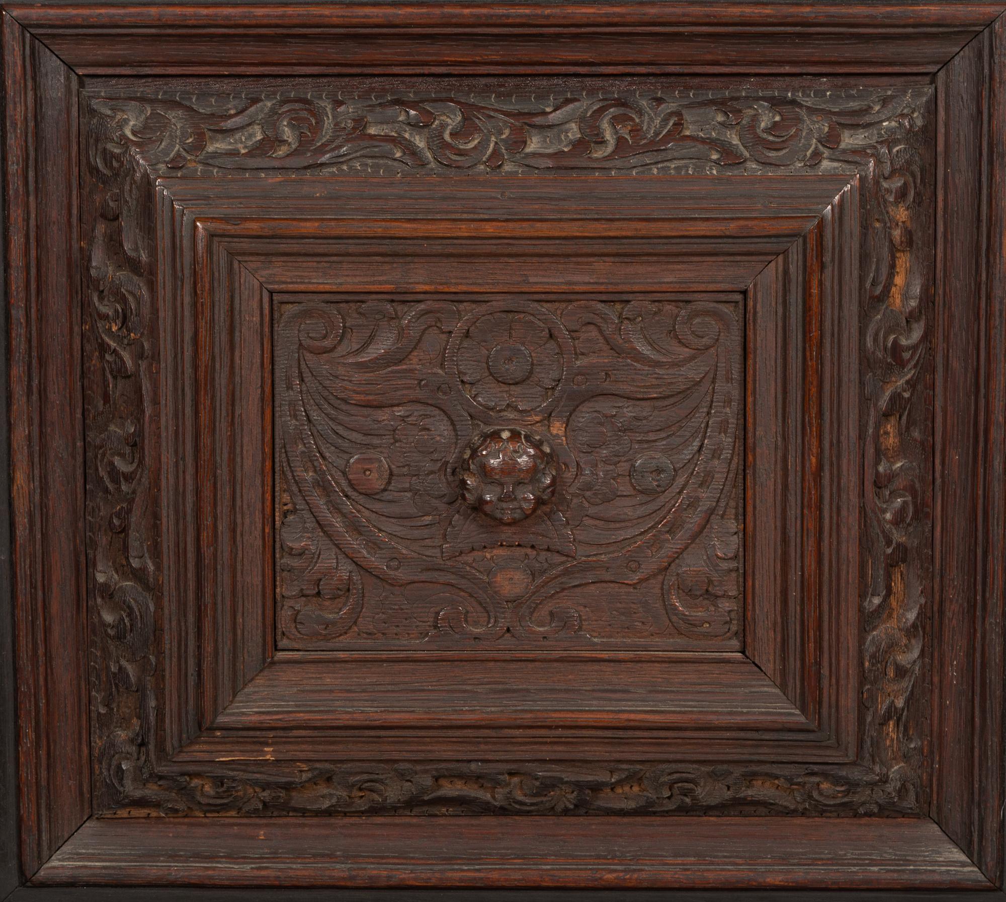 A Pair of Continental Carved Oak Cabinets on Stands