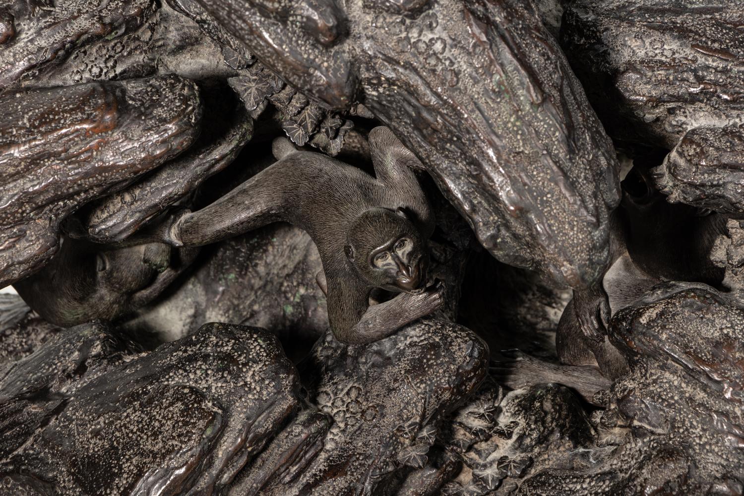 A Japanese Bronze Figural Group of a Hawk Hunting Monkeys