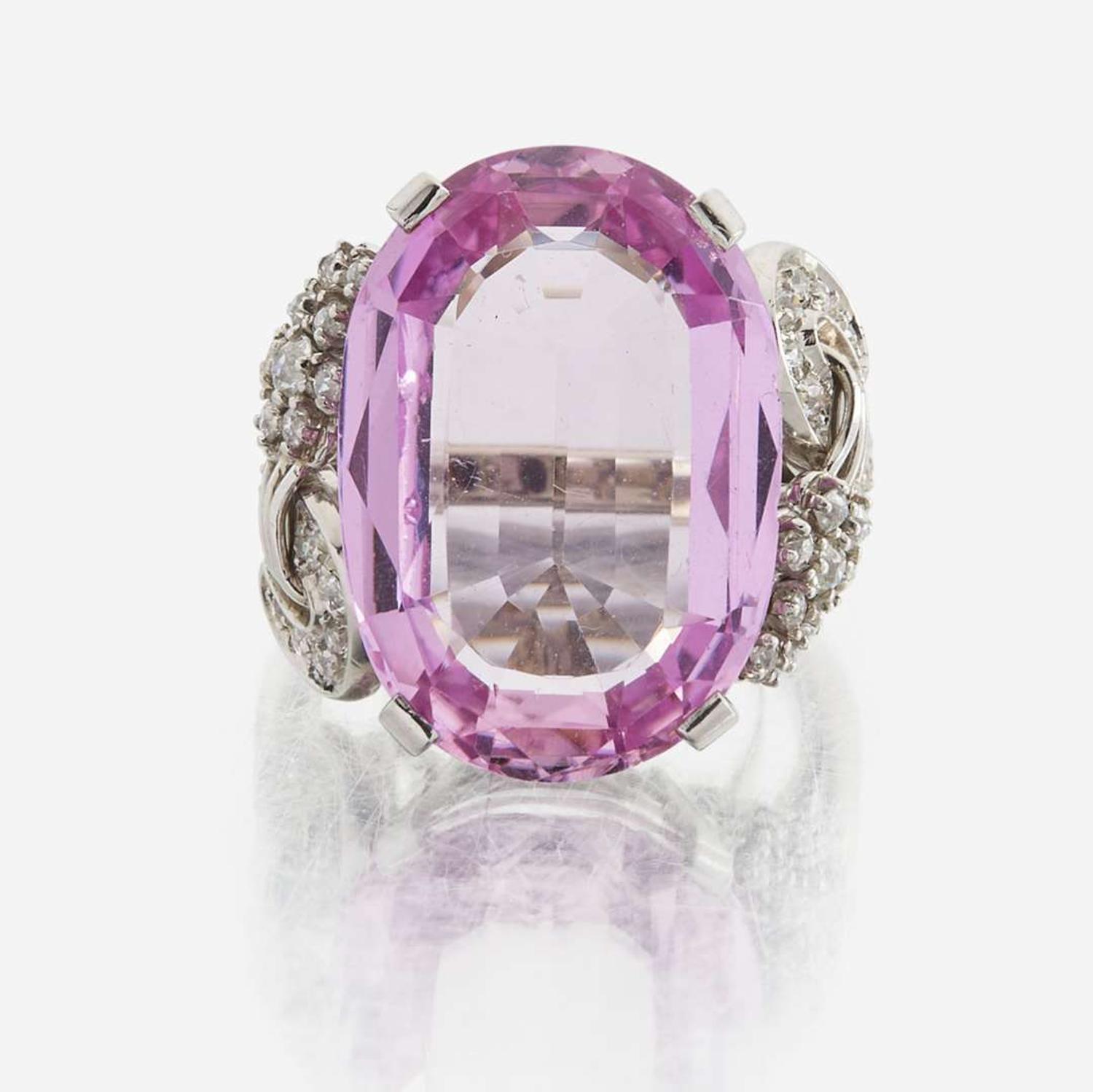 An 18K white gold, pink topaz, and diamond ring