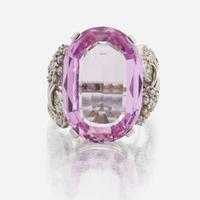 An 18K white gold, pink topaz, and diamond ring