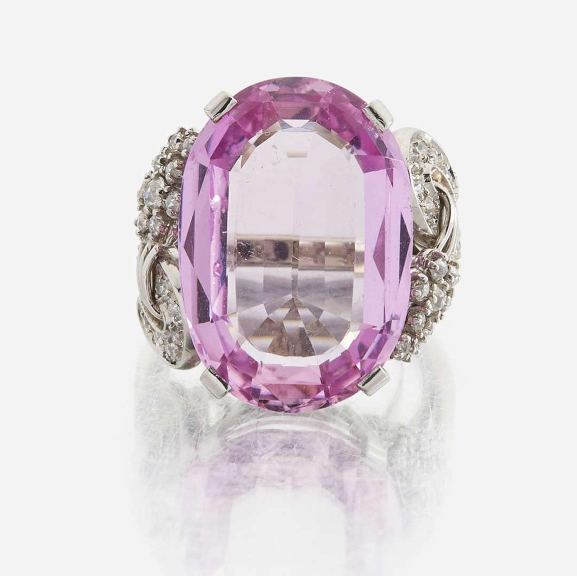 An 18K white gold, pink topaz, and diamond ring